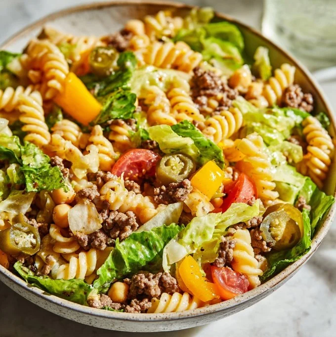 Ground Beef Chickpea Pasta Salad in a bowl with fresh vegetables