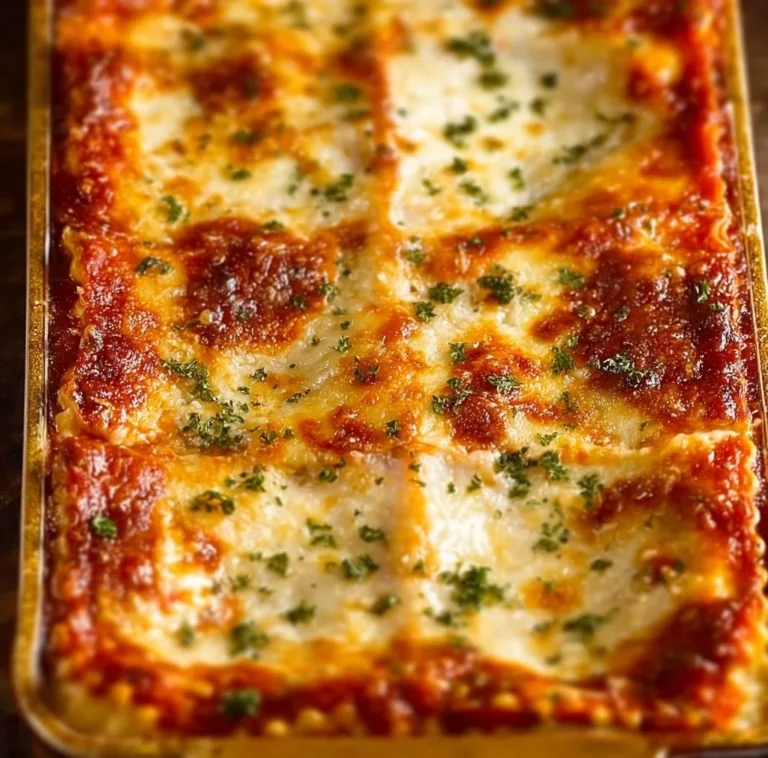 Delicious Million Dollar Lasagna served with fresh herbs and toppings.