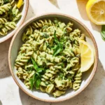 Delicious Green Goddess Pasta topped with fresh herbs and served in a bowl